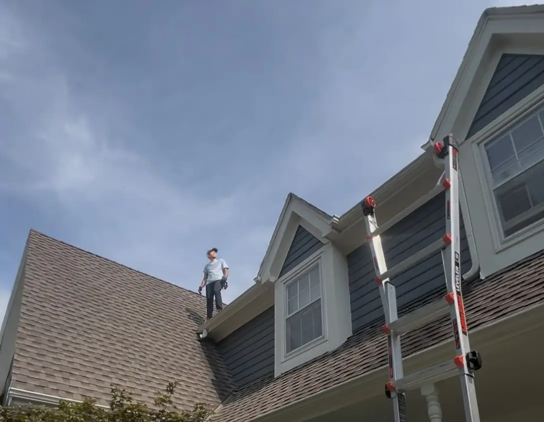 Man checking roofing work